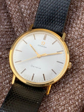 Load image into Gallery viewer, 1967 Gold 18k Omega Genéve with original buckle, original leather strap and original crystal